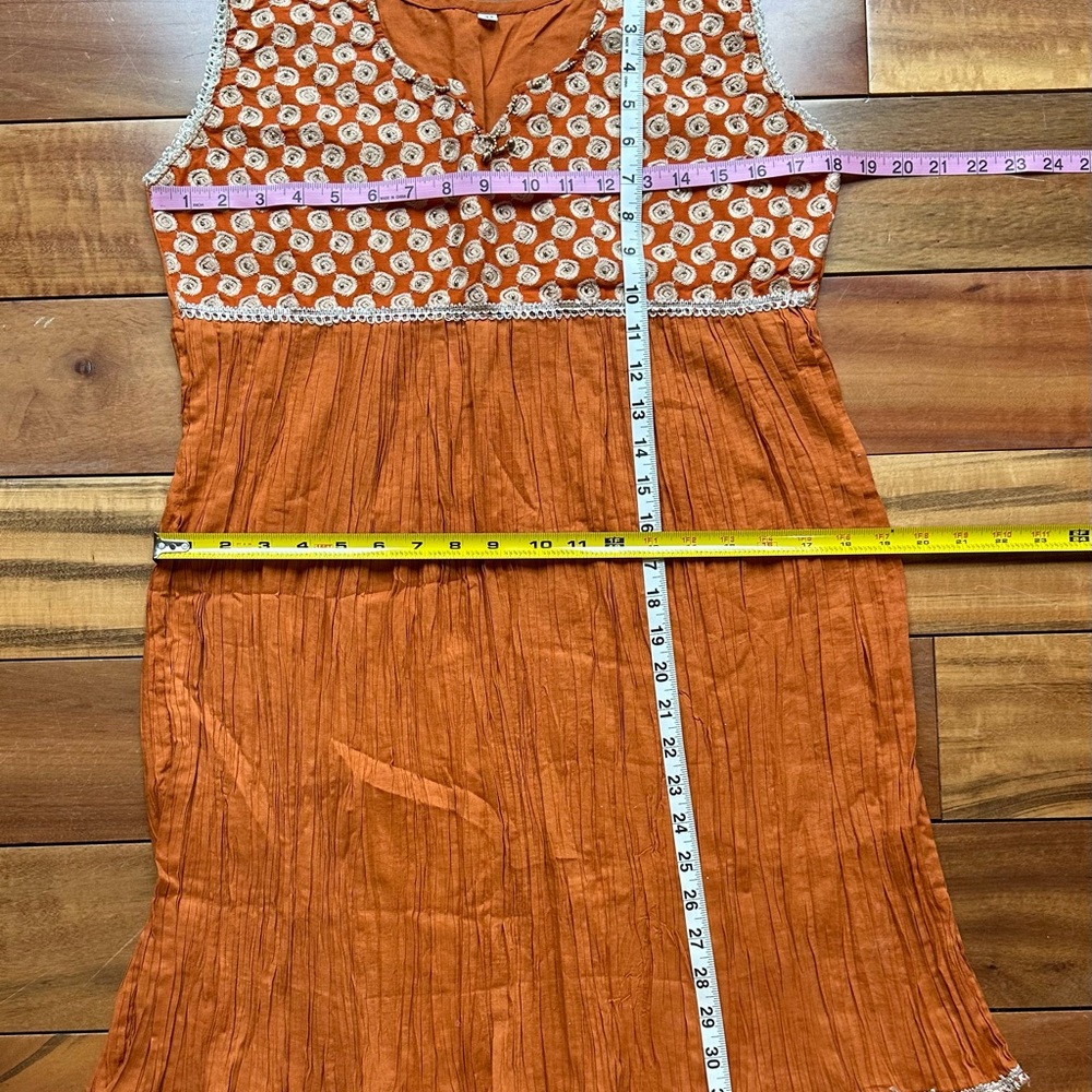 Orange/gold kurti
With beaded and embroidered detail